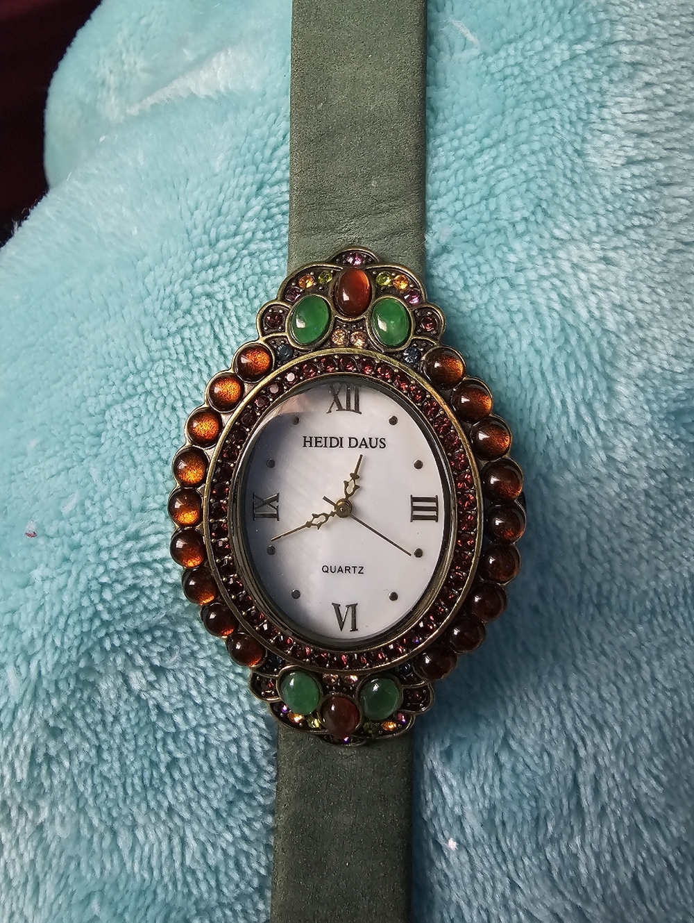 Heidi Daus Jeweled Oval Watch in Green and Amber Accents